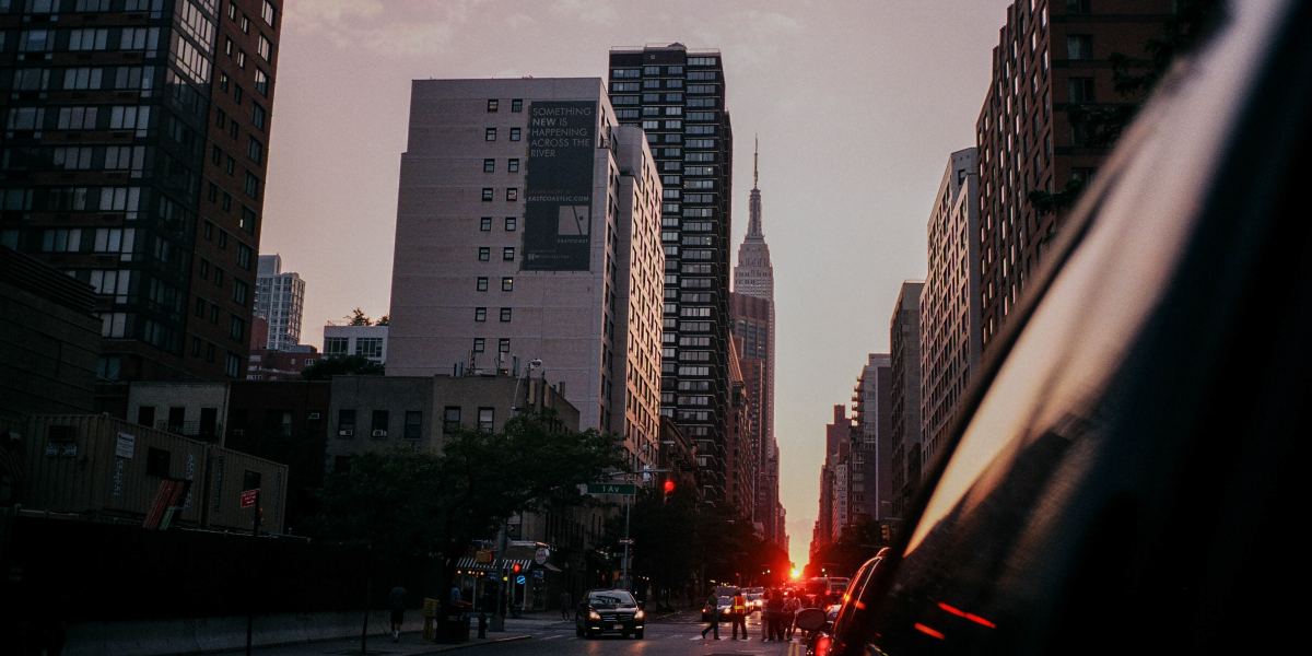 Riding in an rideshare app view of manhattan sunset